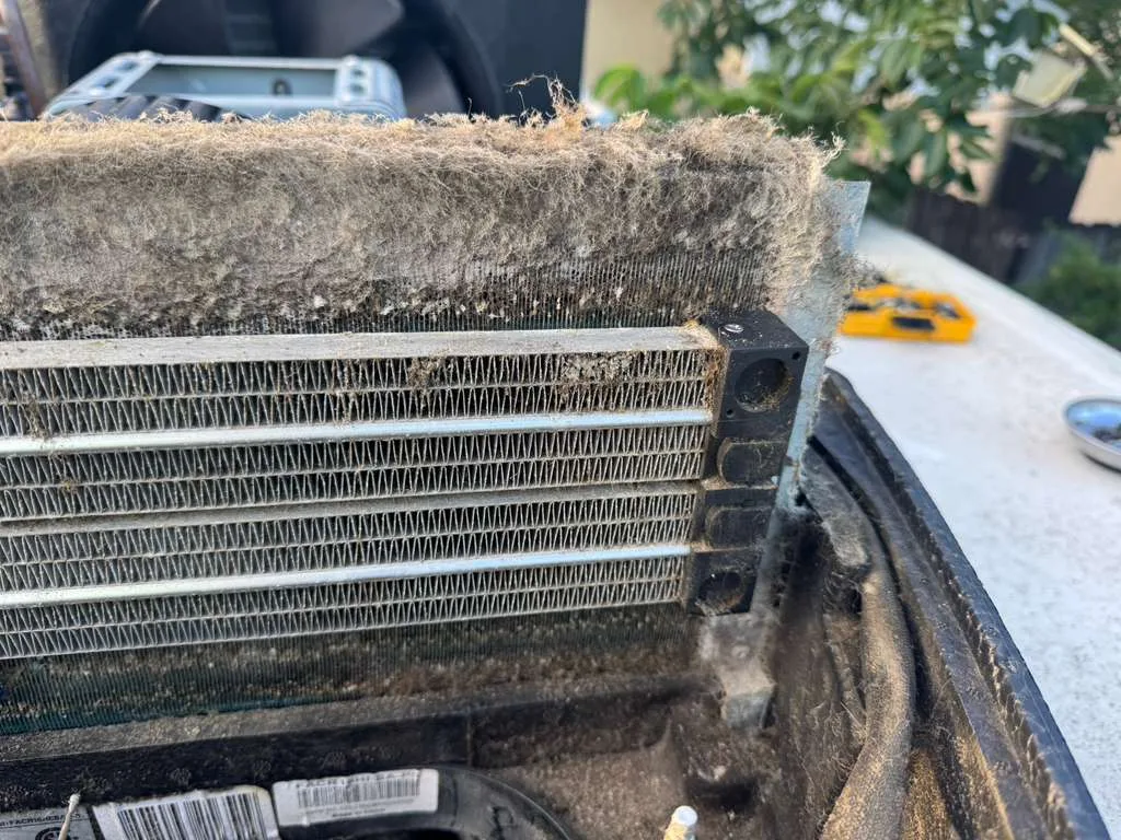 Dirty rooftop AC condenser coils on an RV - common cause of weak cooling in Florida heat