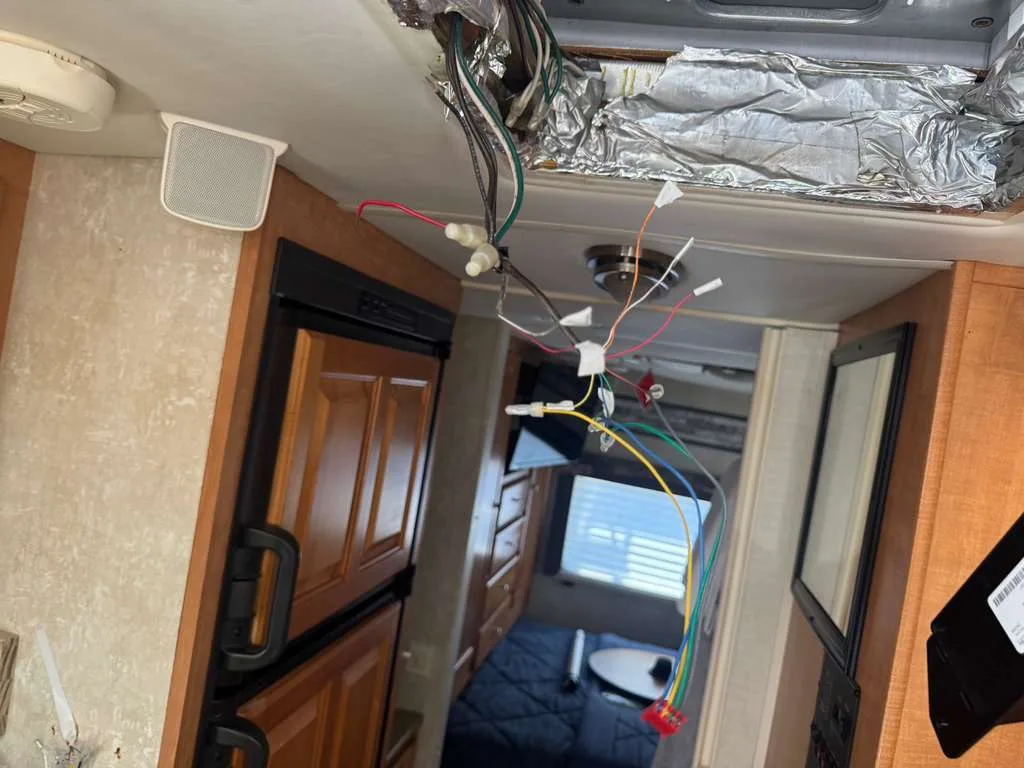 Diagnosing wiring and control circuits on an RV generator during a mobile service call in Florida
